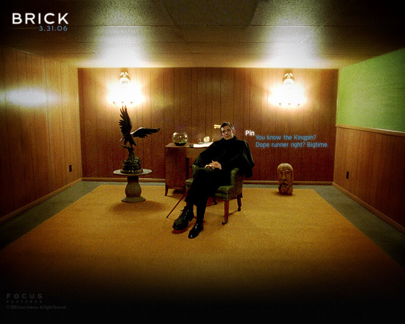 Man in a wood-paneled room