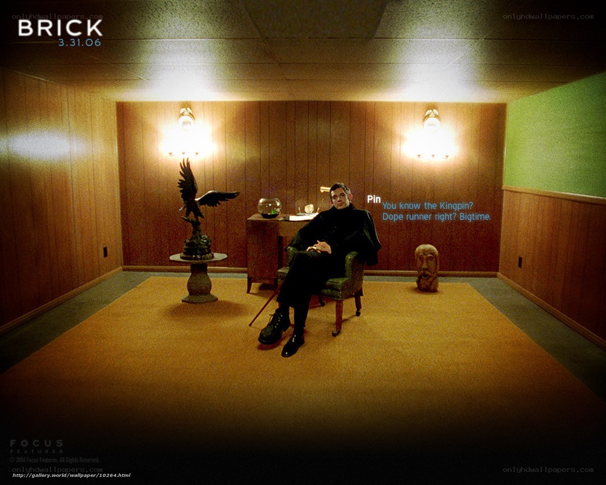 Man in a wood-paneled room