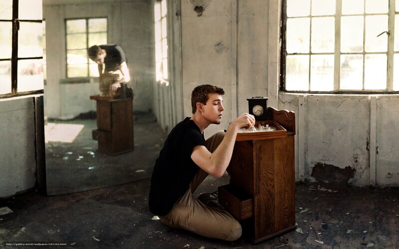 Man in abandoned room with chess set
