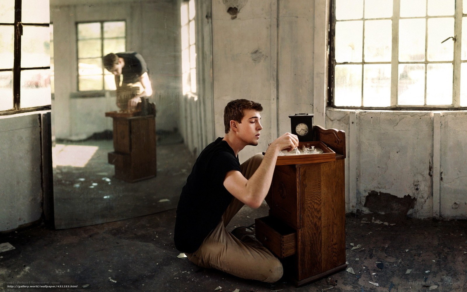 Man in abandoned room with chess set