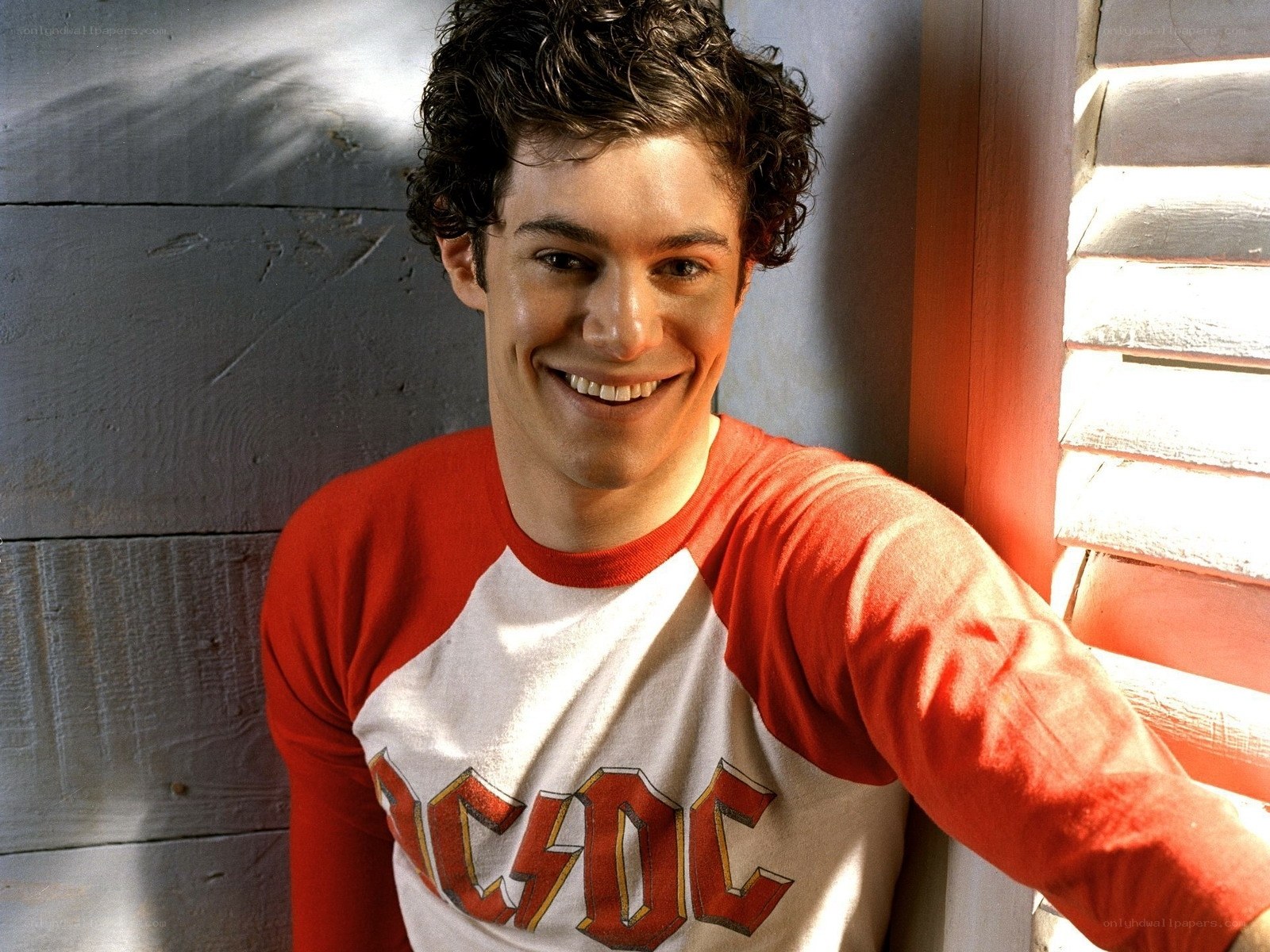 man in acdc shirt smiling