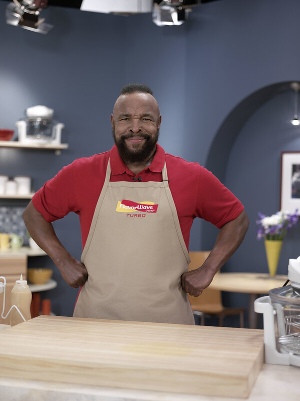 man in apron smiling