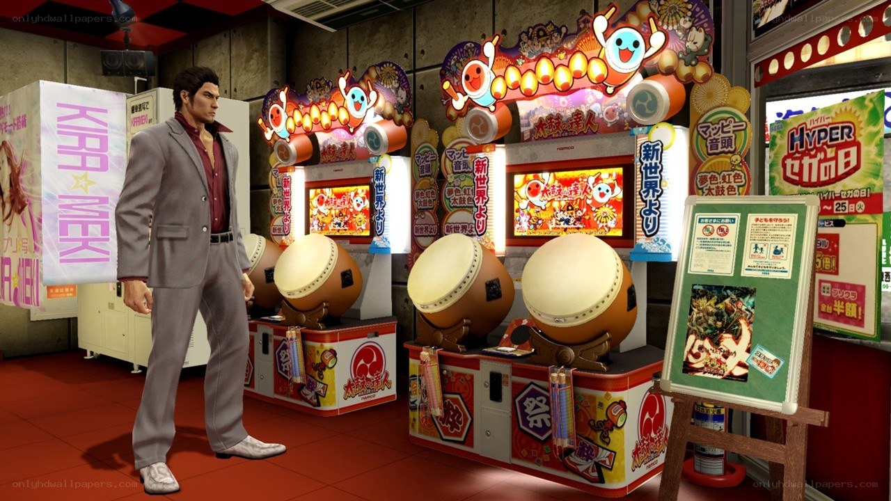 Man in arcade with taiko machines