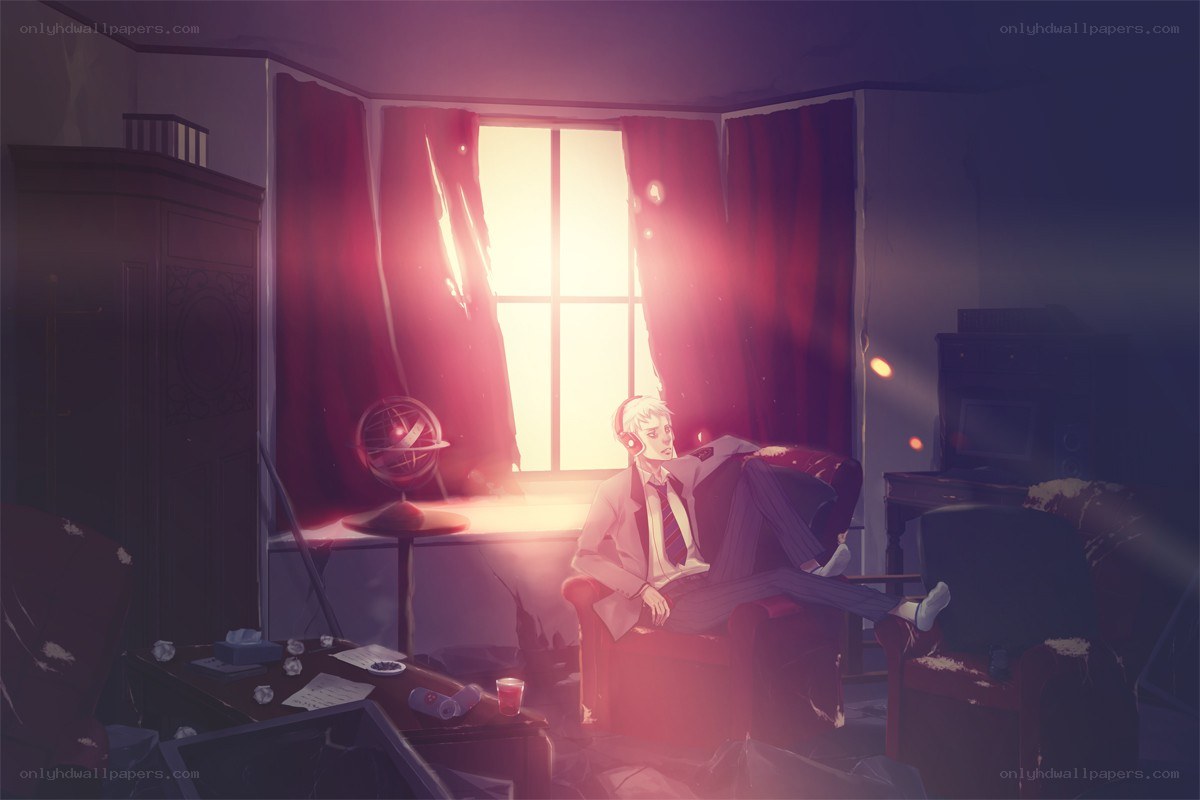 man in armchair by window