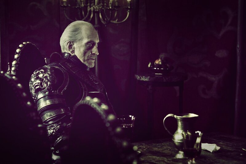 man in armor at a table