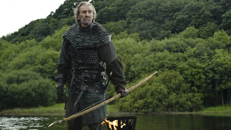 Man in Armor Holding Bow — Green, Dramatic
