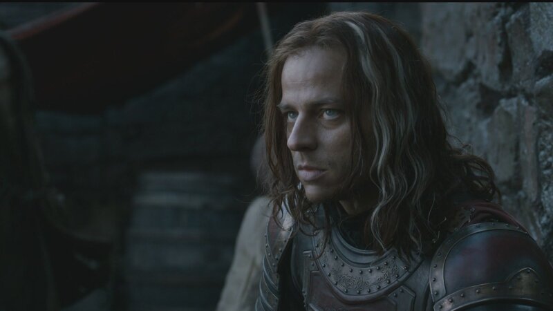 man in armor looking away