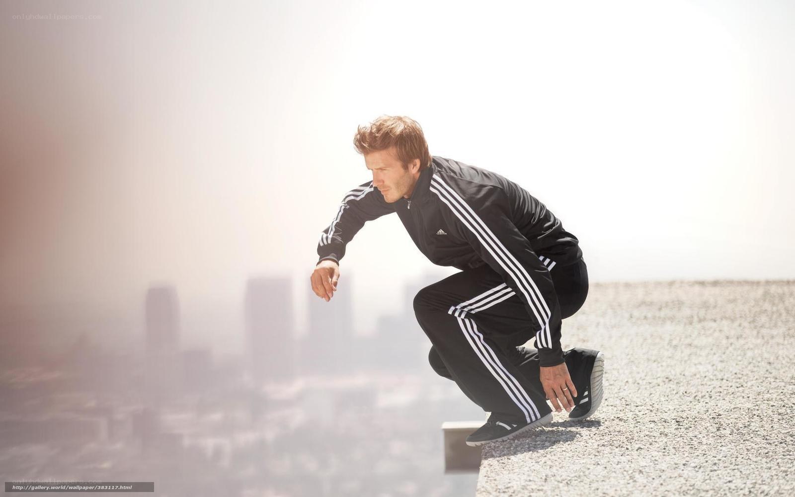 man in athletic wear on rooftop