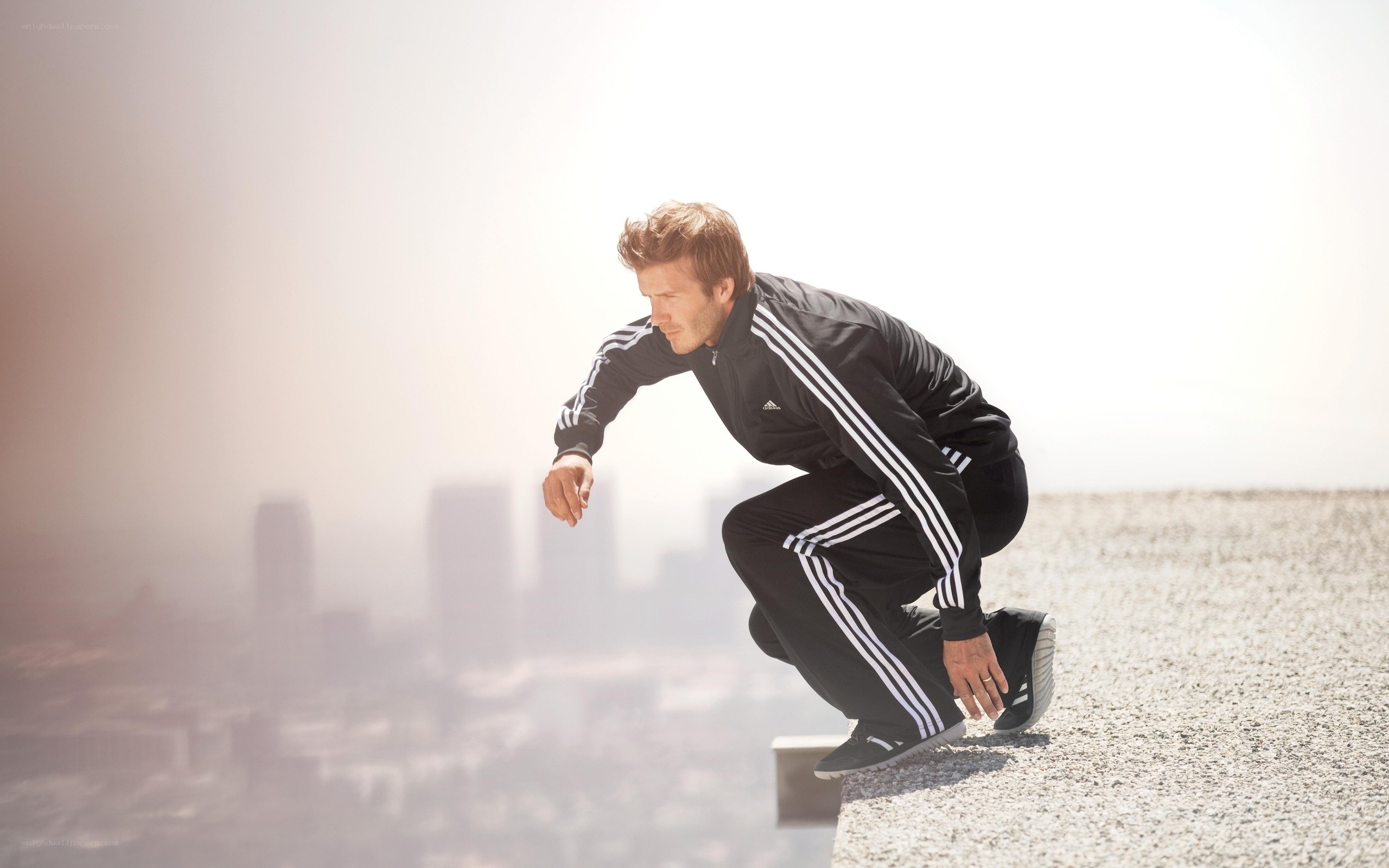 man in athletic wear on rooftop