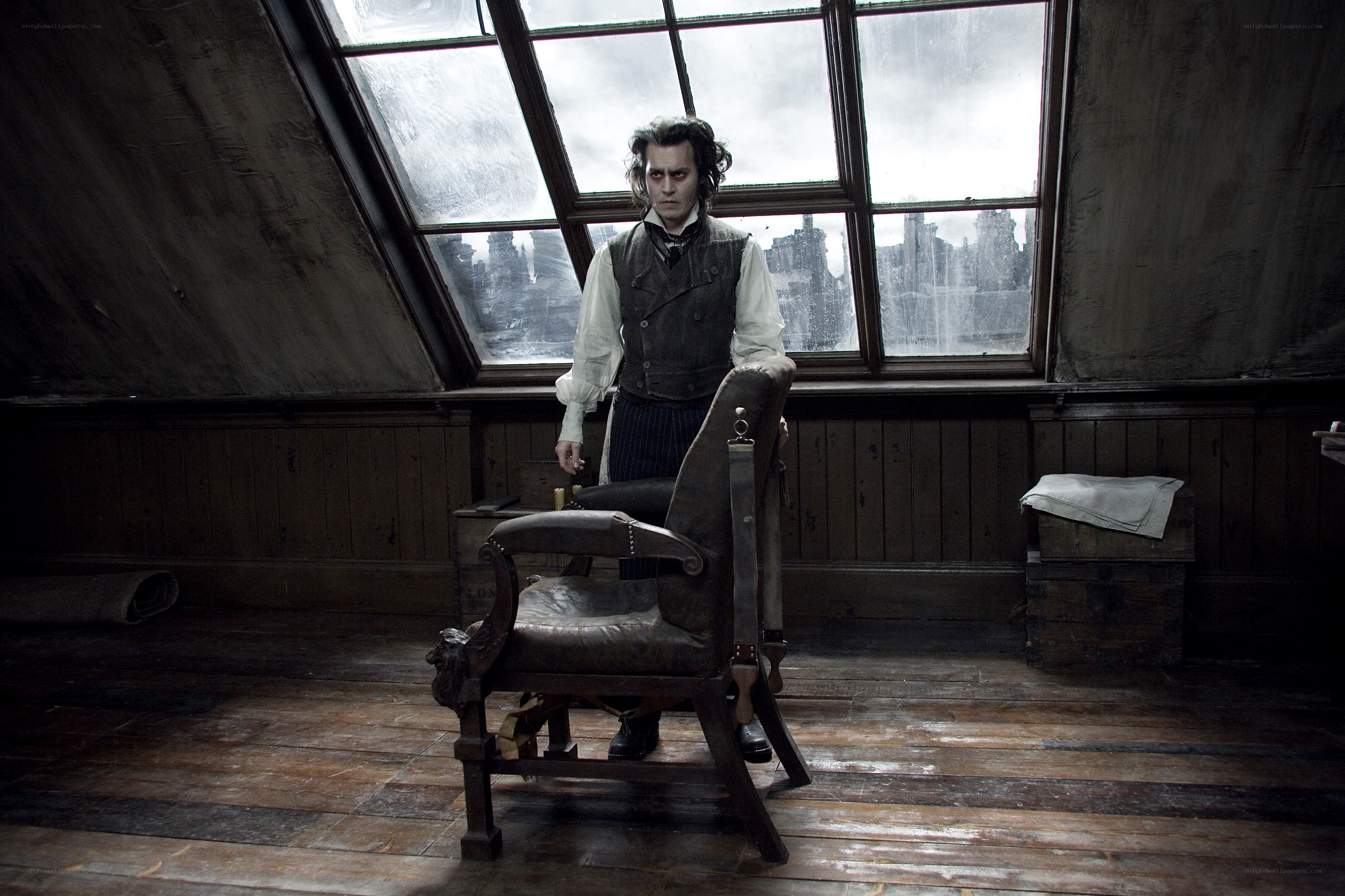 man in attic with chair