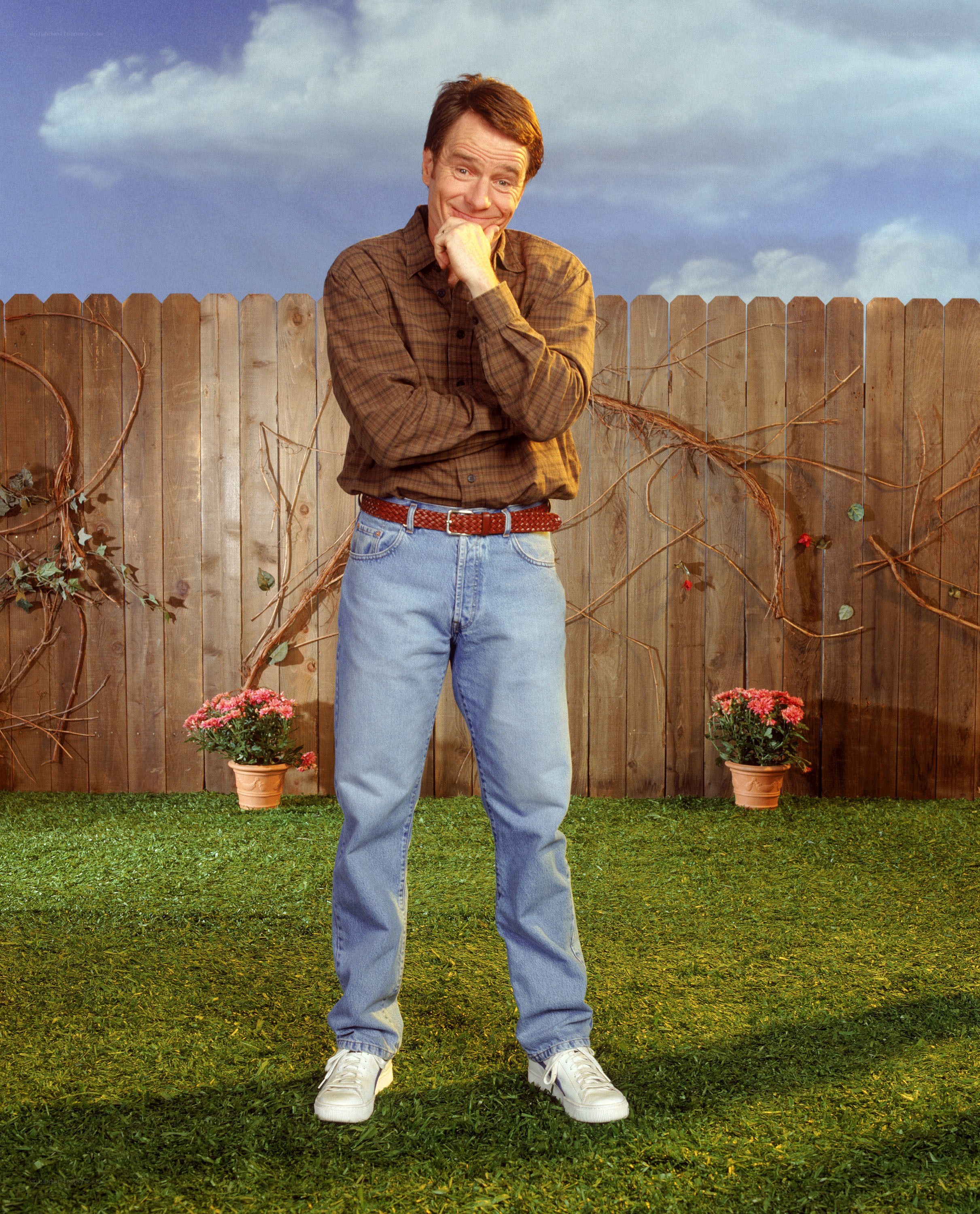 Man in backyard with fence