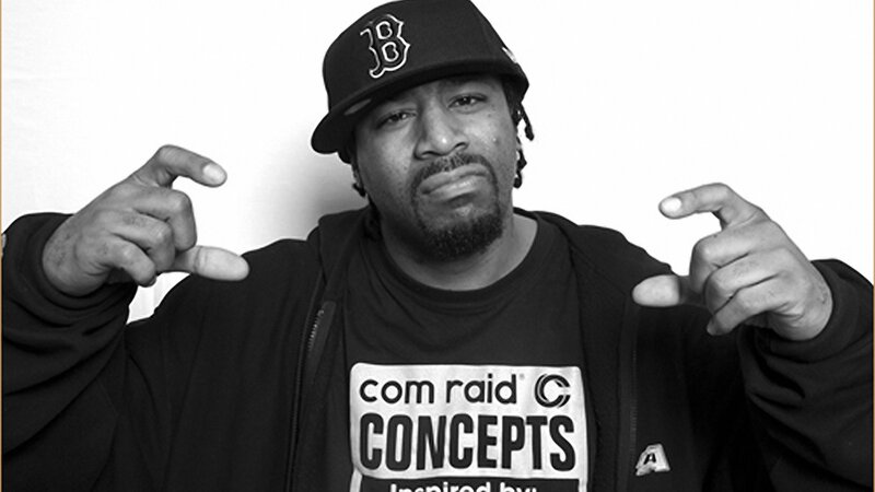 man in baseball cap pointing
