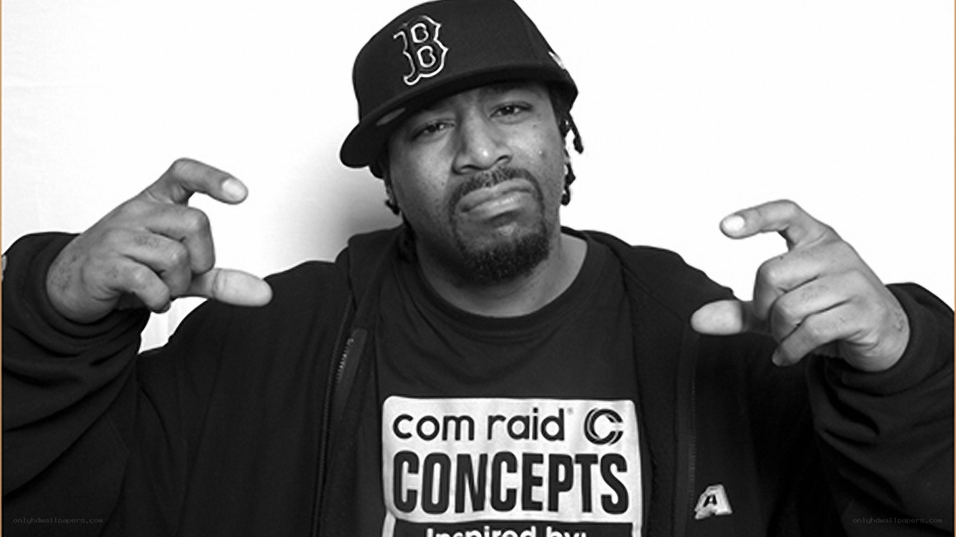 man in baseball cap pointing