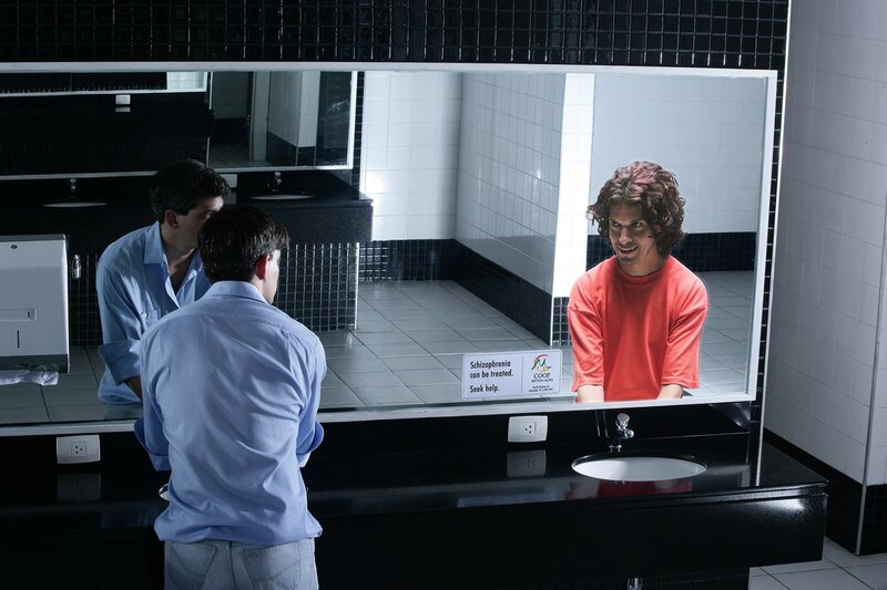Man in bathroom mirror