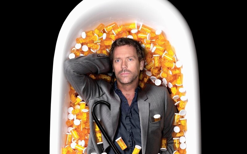 Man in Bathtub of Pills — White, Dramatic, Photograph