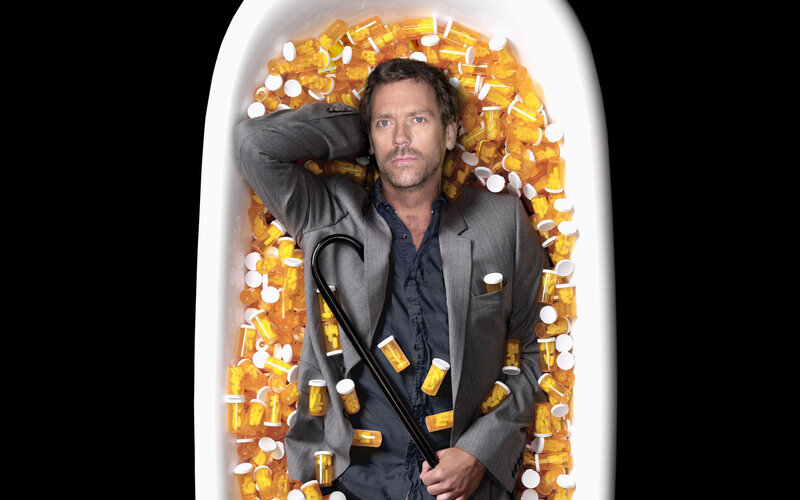 Man in Bathtub of Pills — White, Dramatic, Photograph, Umbrella
