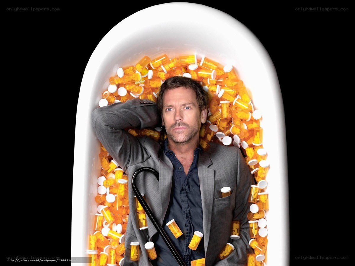man in bathtub with pills
