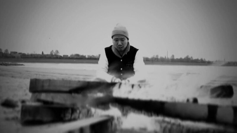 Man in Beanie by Water — Black