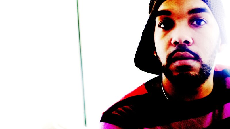 man in beanie looking at camera