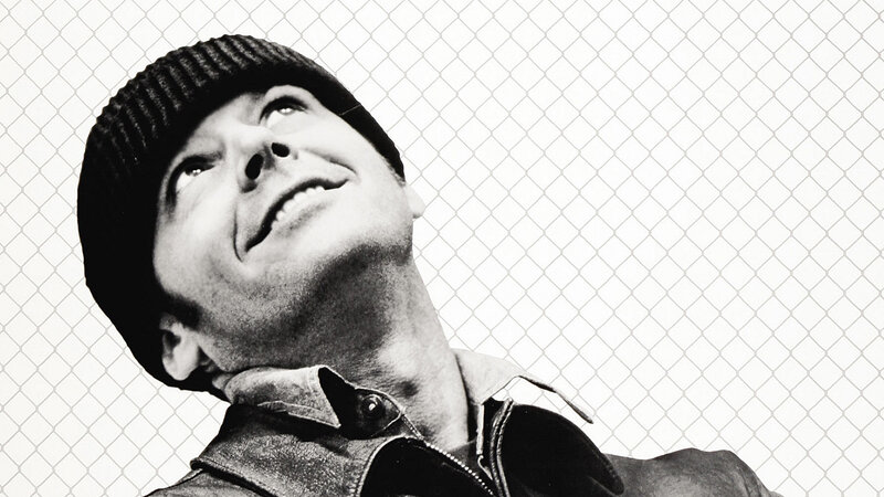 man in beanie looking up