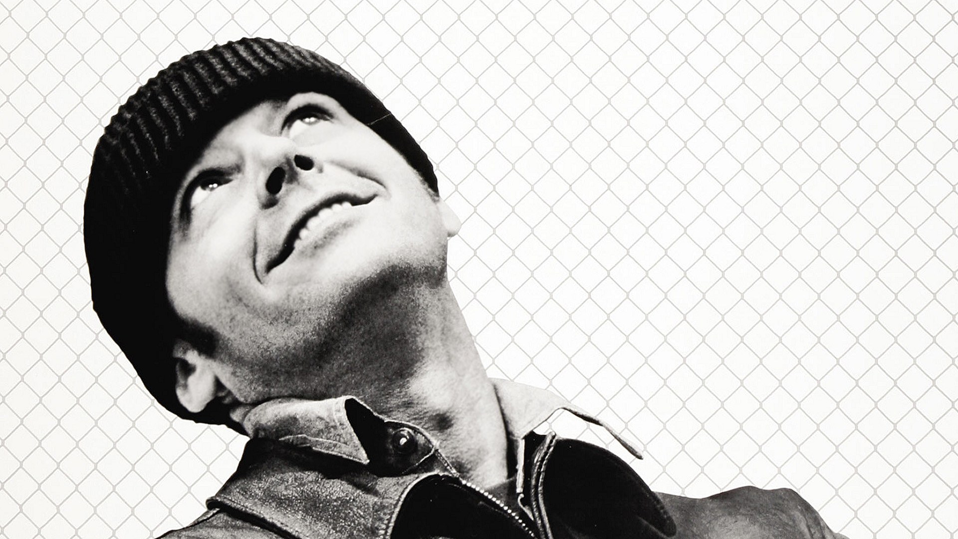 man in beanie looking up