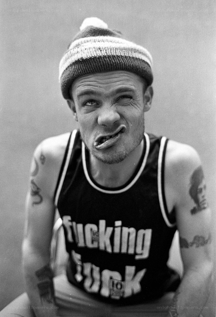Man in beanie making face