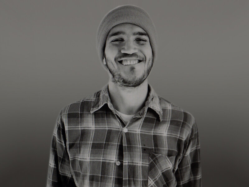 man in beanie smiling