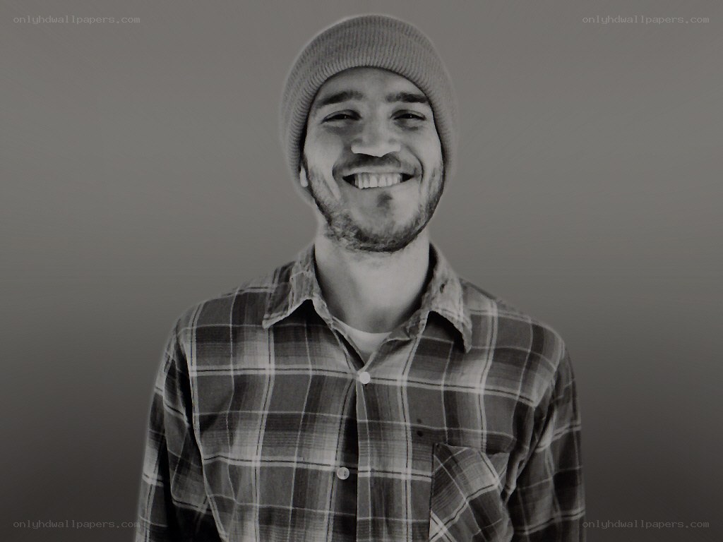 man in beanie smiling