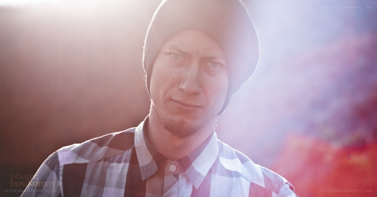 man in beanie with lens flare
