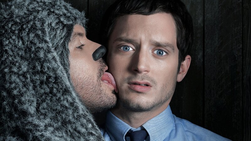 man in bear costume kissing man
