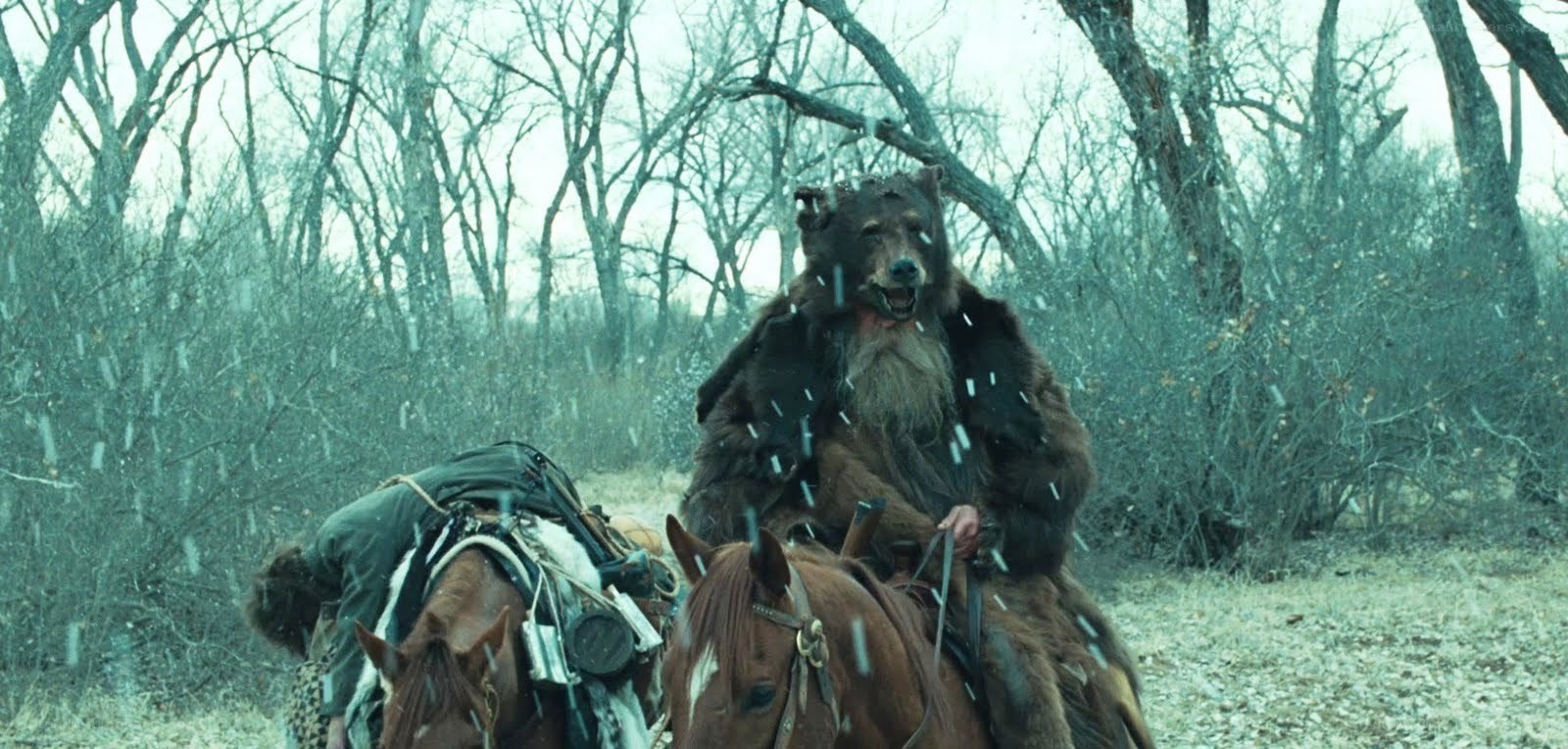 man in bear costume on horse