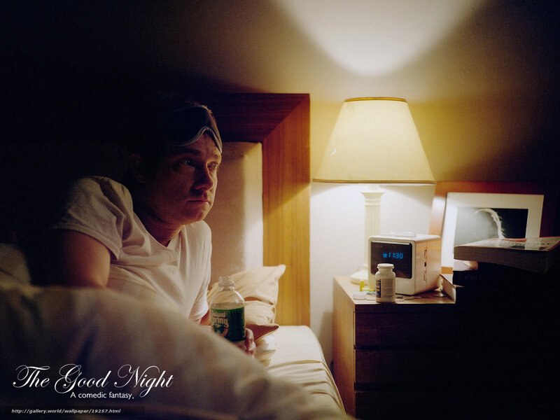 Man in bed with sleep mask
