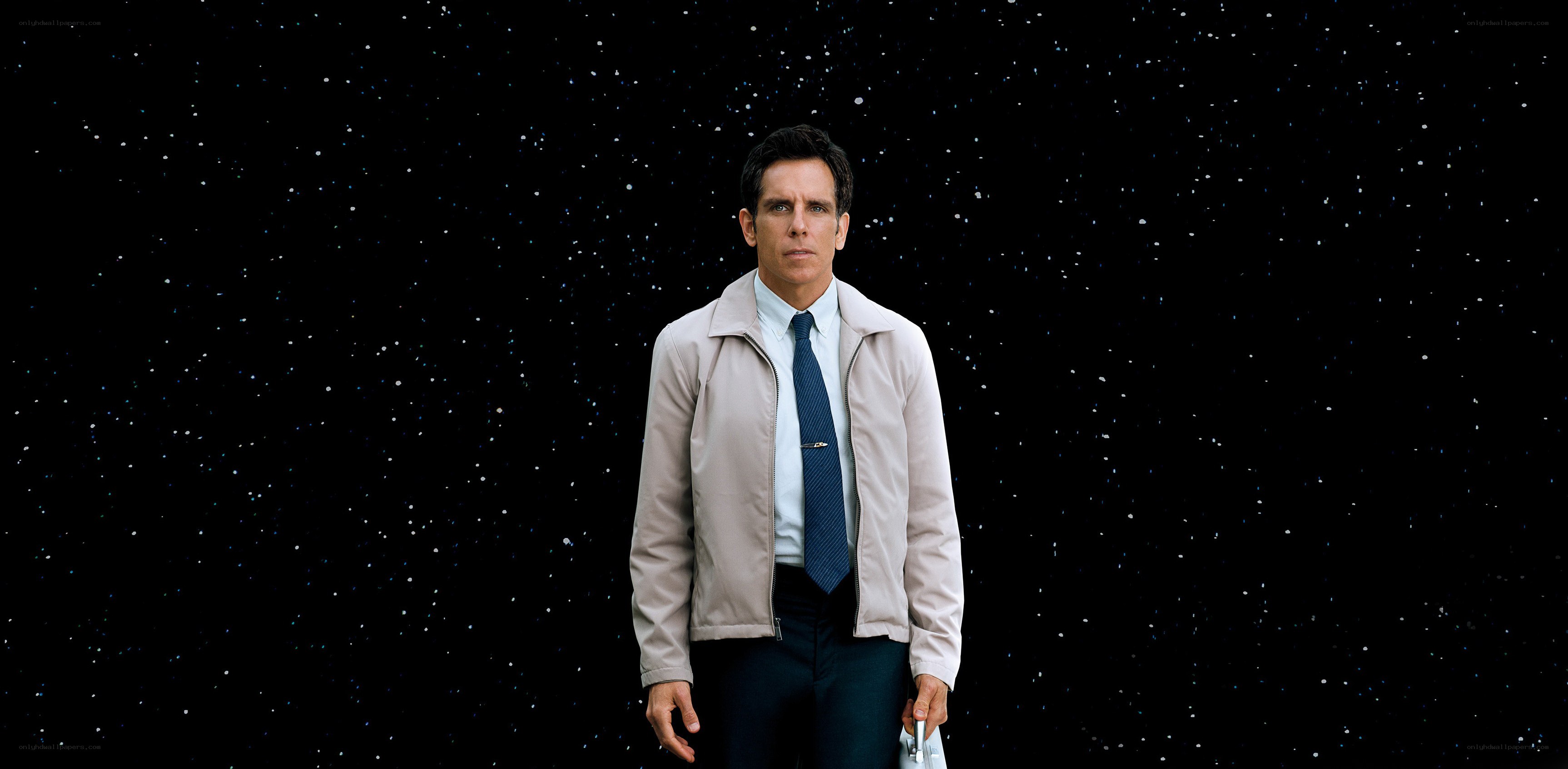 man in beige jacket against stars
