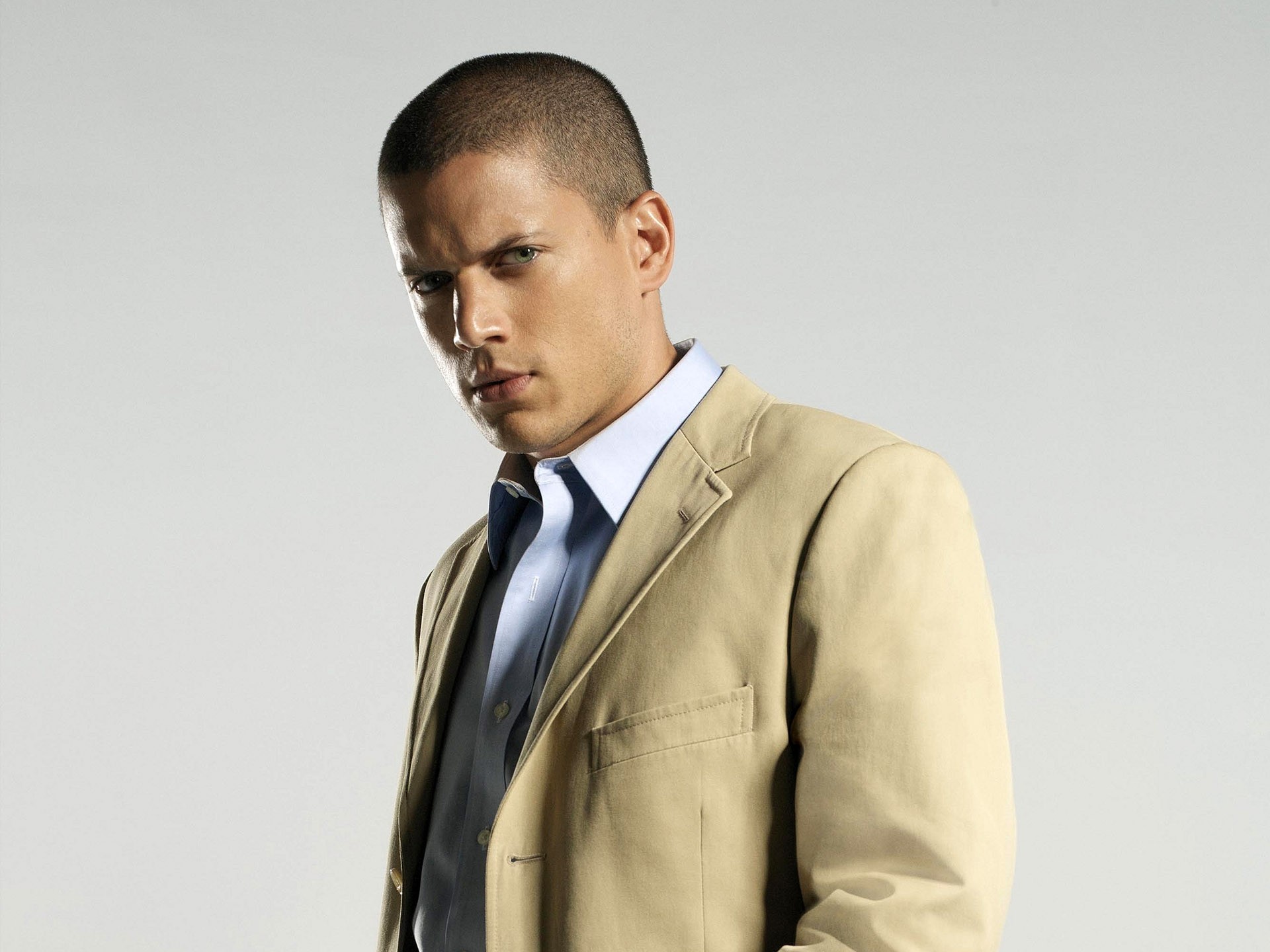 man in beige suit