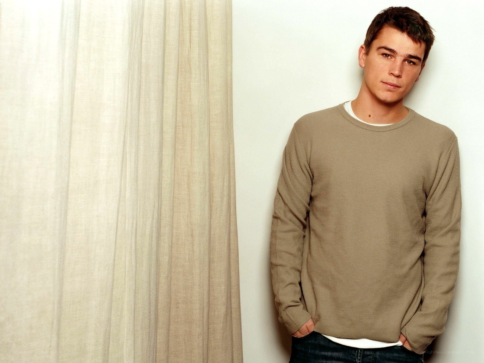 man in beige sweater