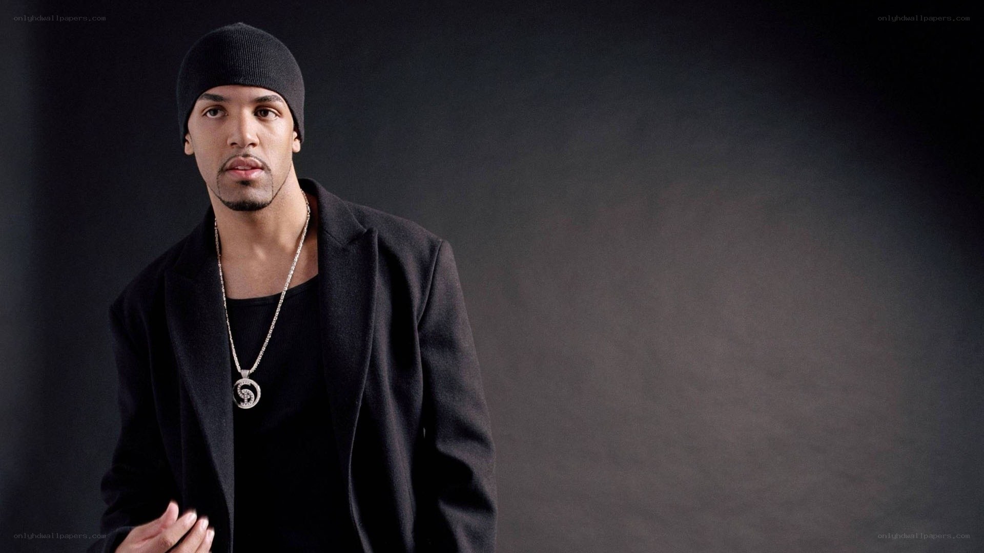 man in black coat and beanie