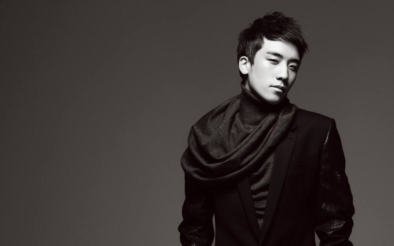 man in black coat and scarf