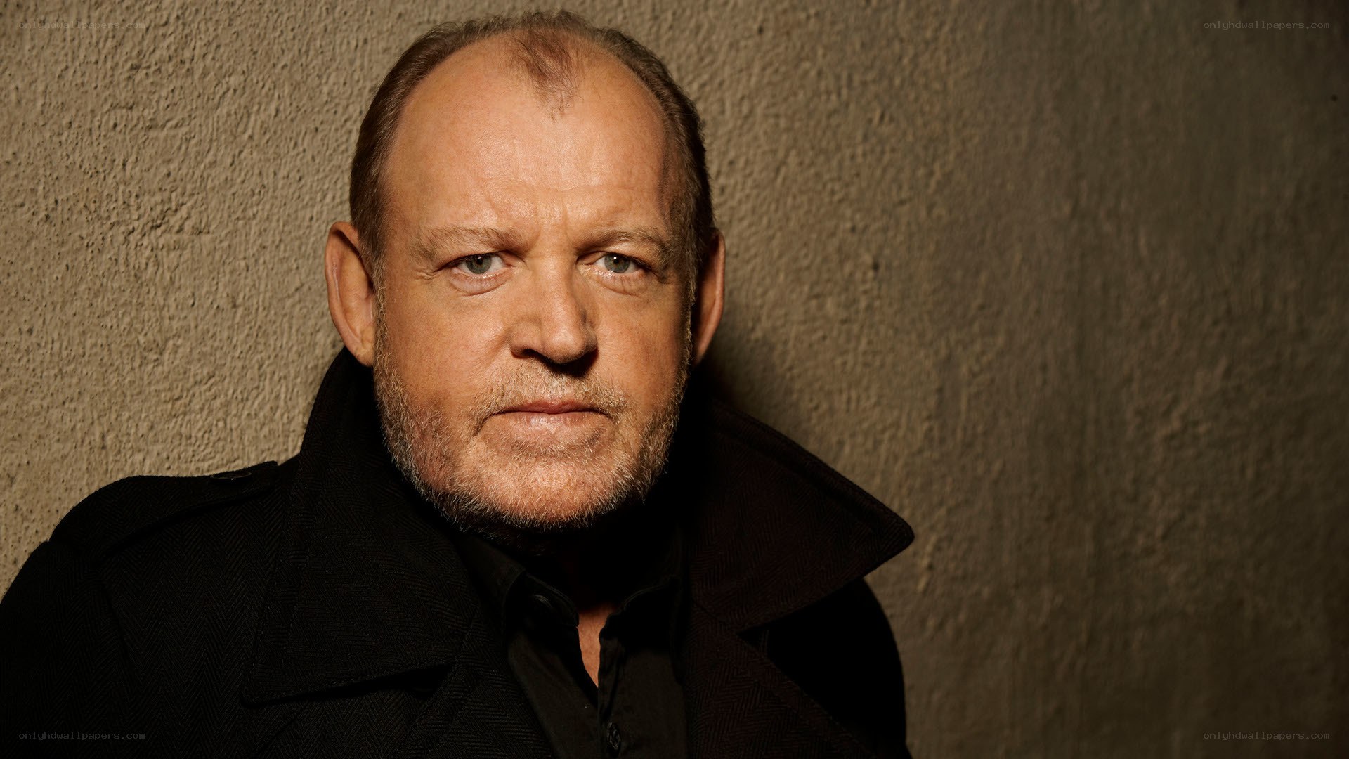man in black coat portrait