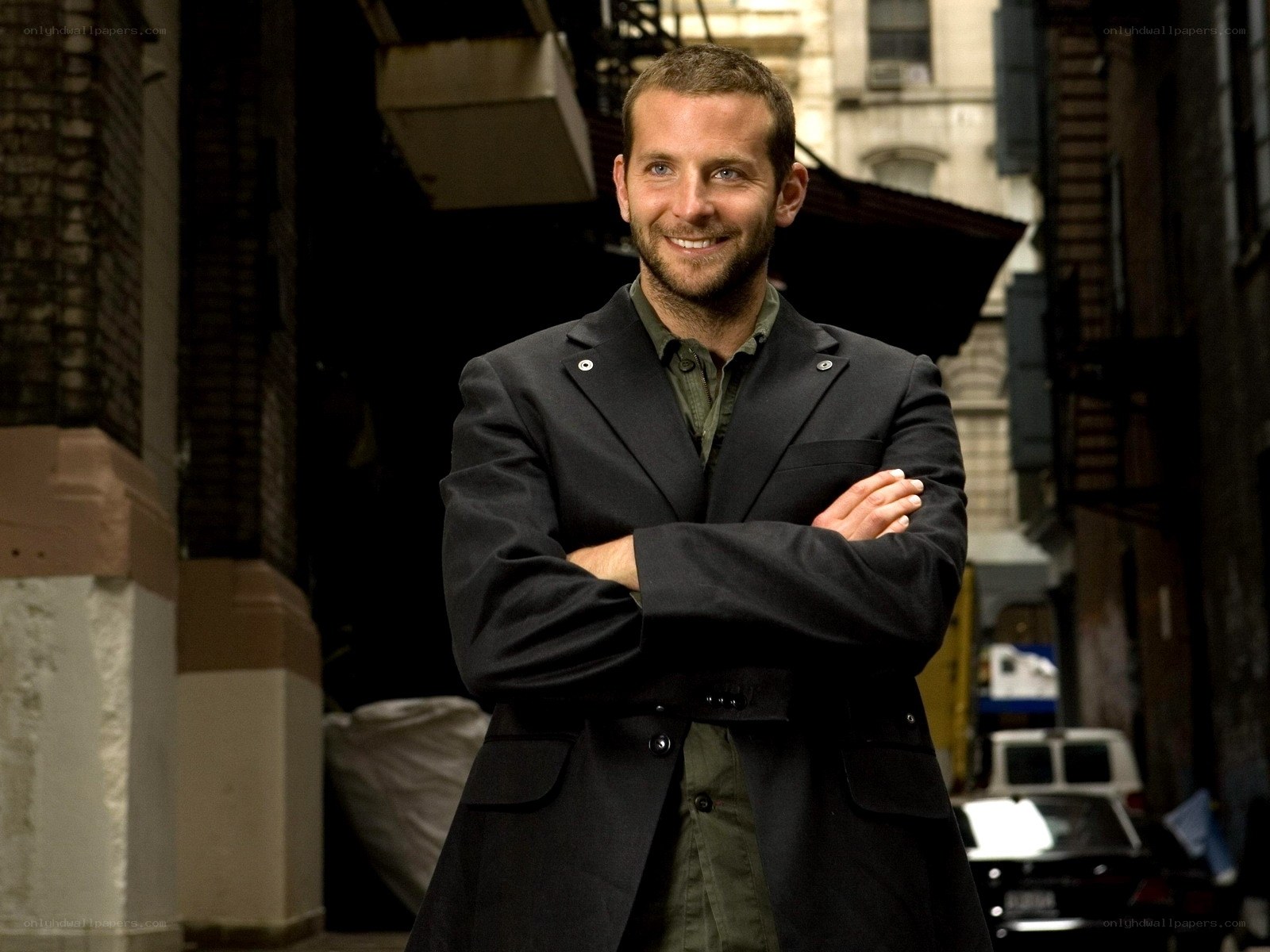 man in black coat smiling