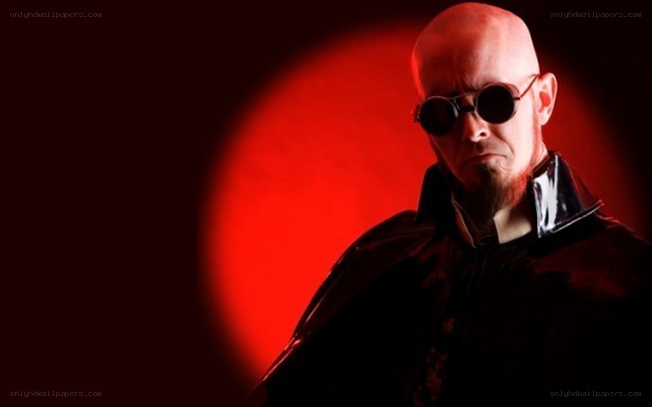 man in black coat with red light