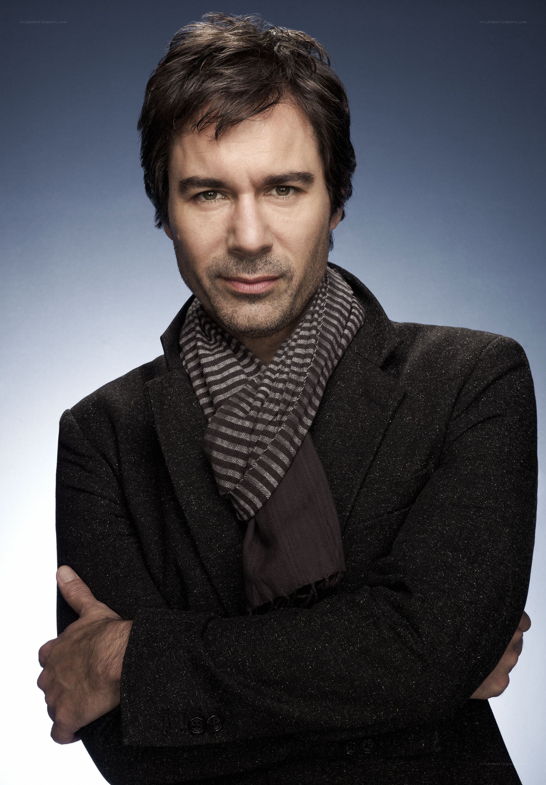 man in black coat with scarf