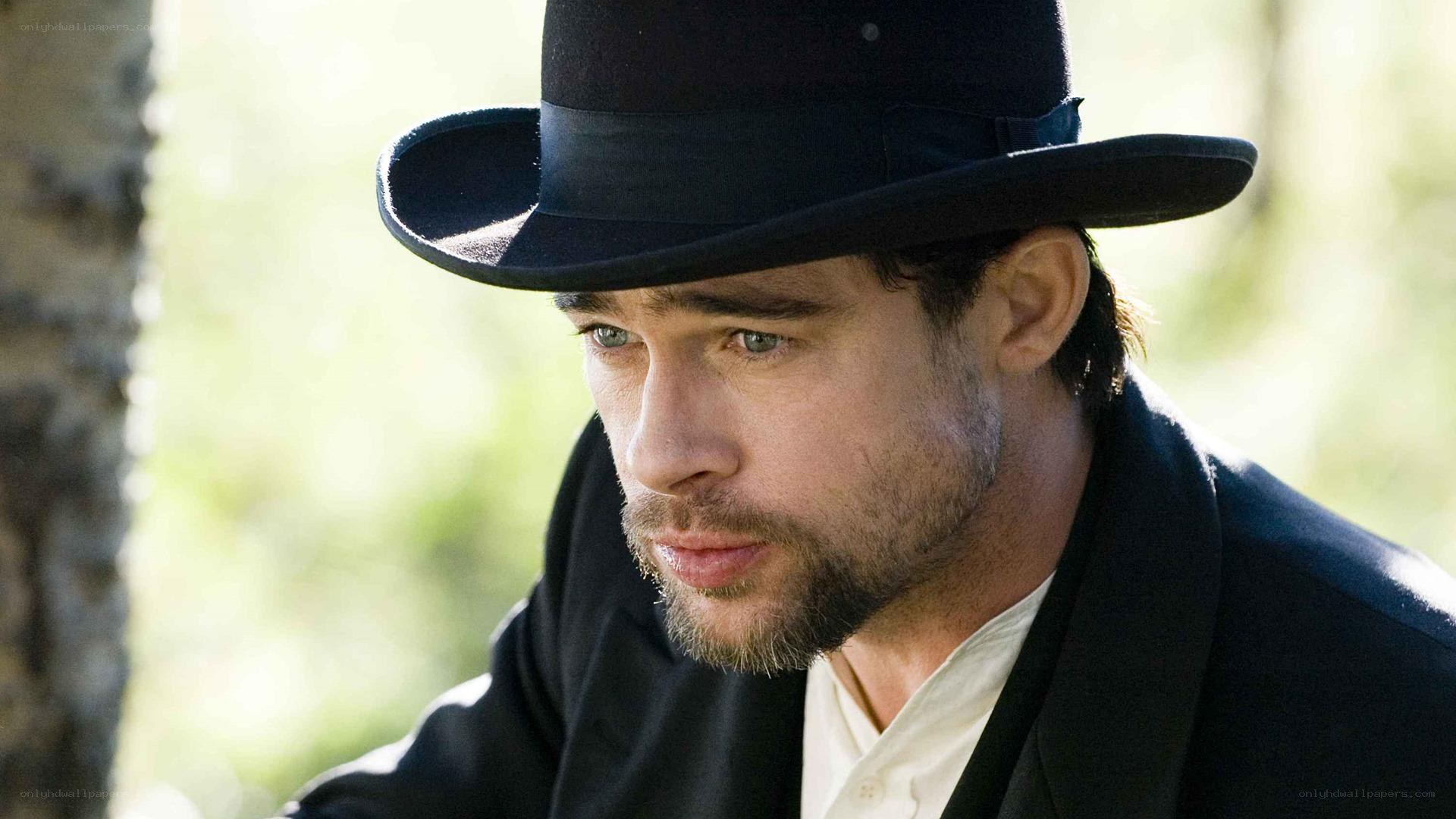 man in black hat and coat
