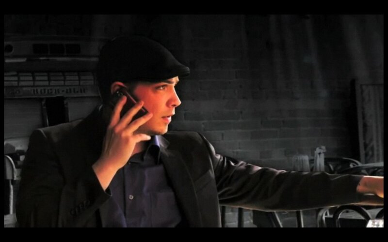 Man in Black Hat on Phone