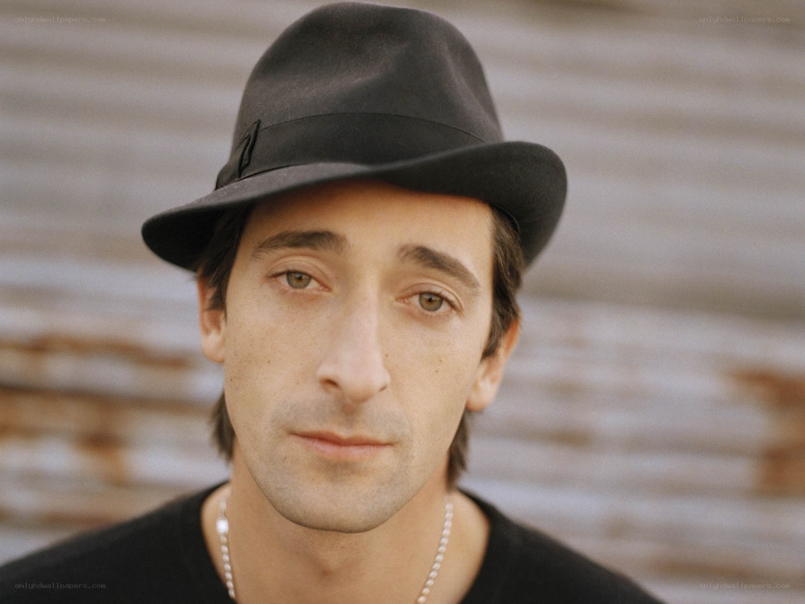 man in black hat portrait