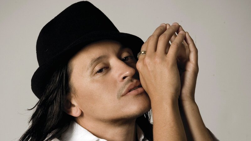 man in black hat posing