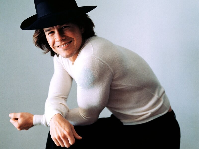 man in black hat smiling