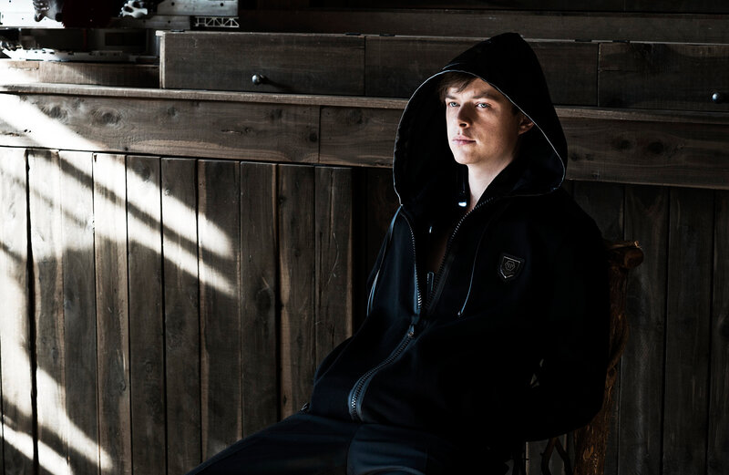 man in black hoodie sitting