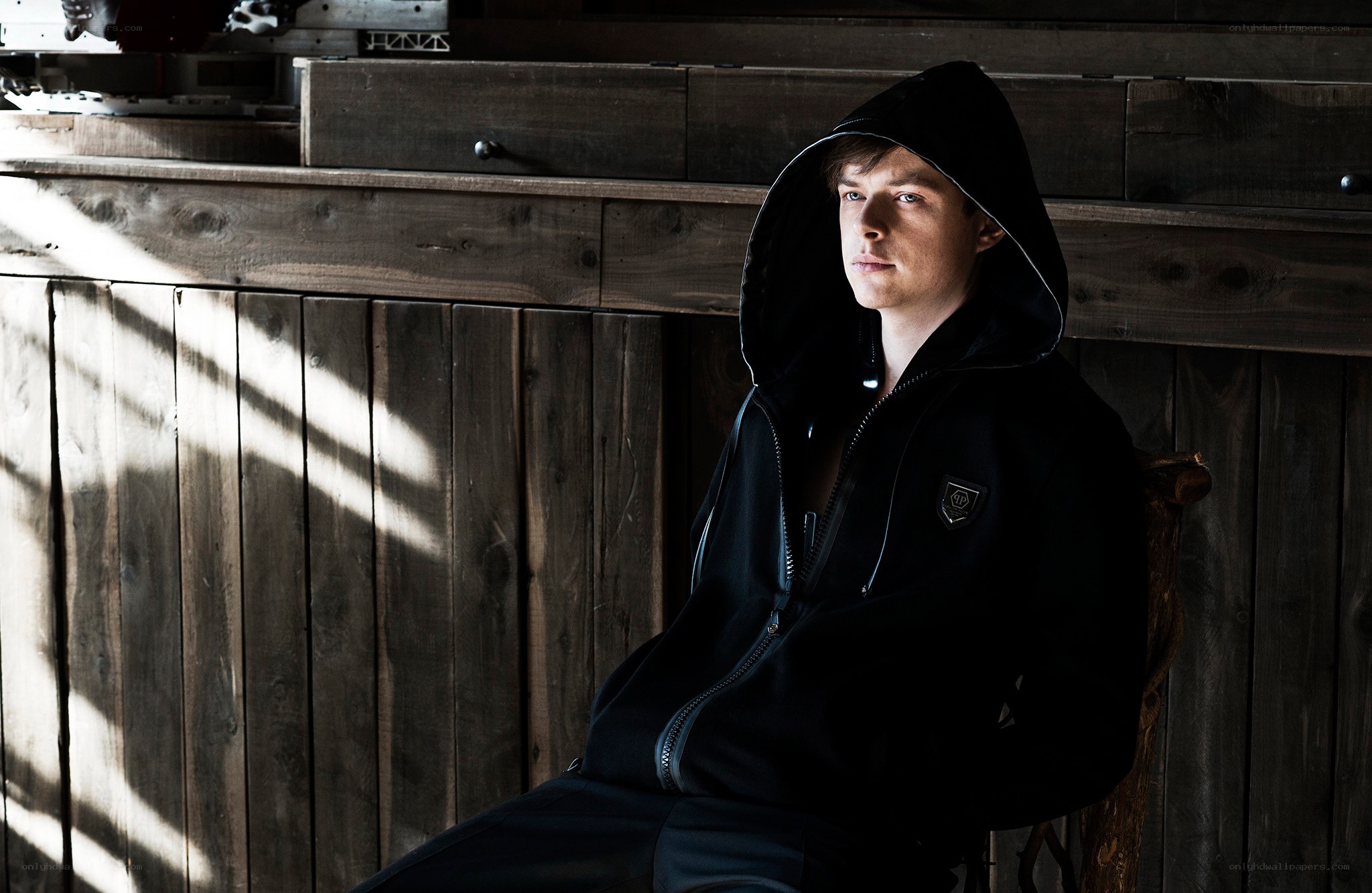 man in black hoodie sitting