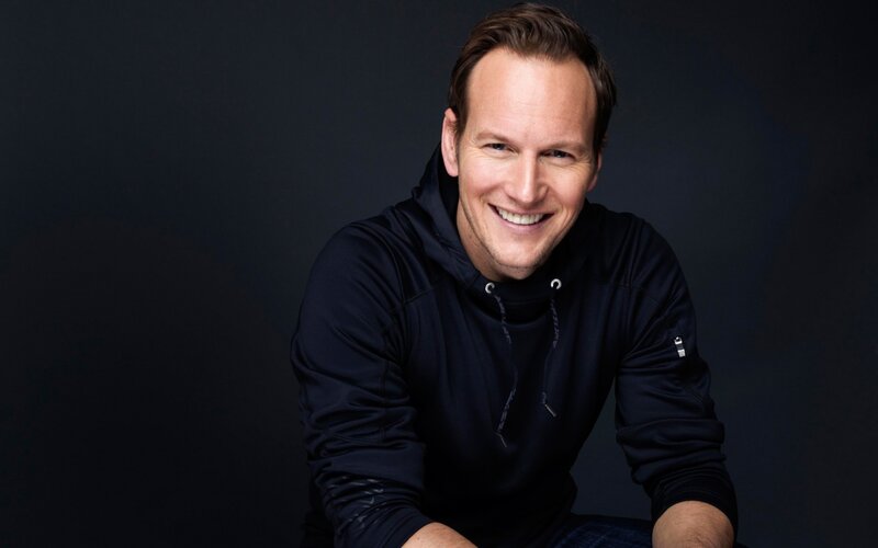man in black hoodie smiling