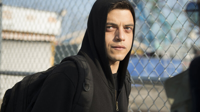 man in black hoodie with backpack